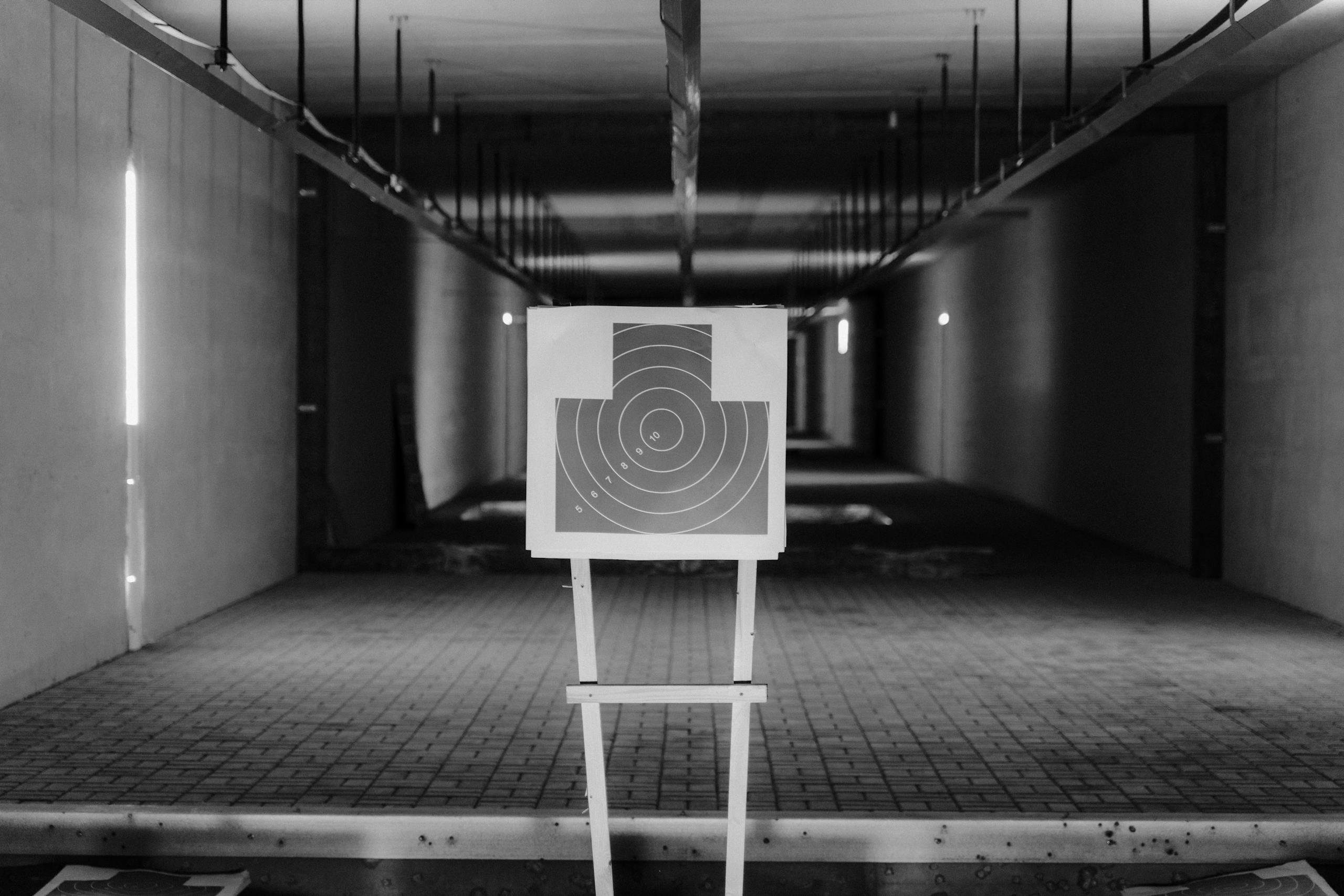 Grayscale Photo of Shooting Target Stand